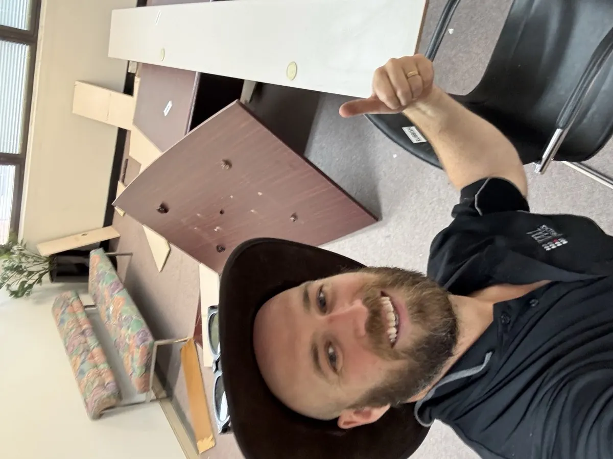 Josh from Bin Chicken Co. giving thumbs up during office clearout